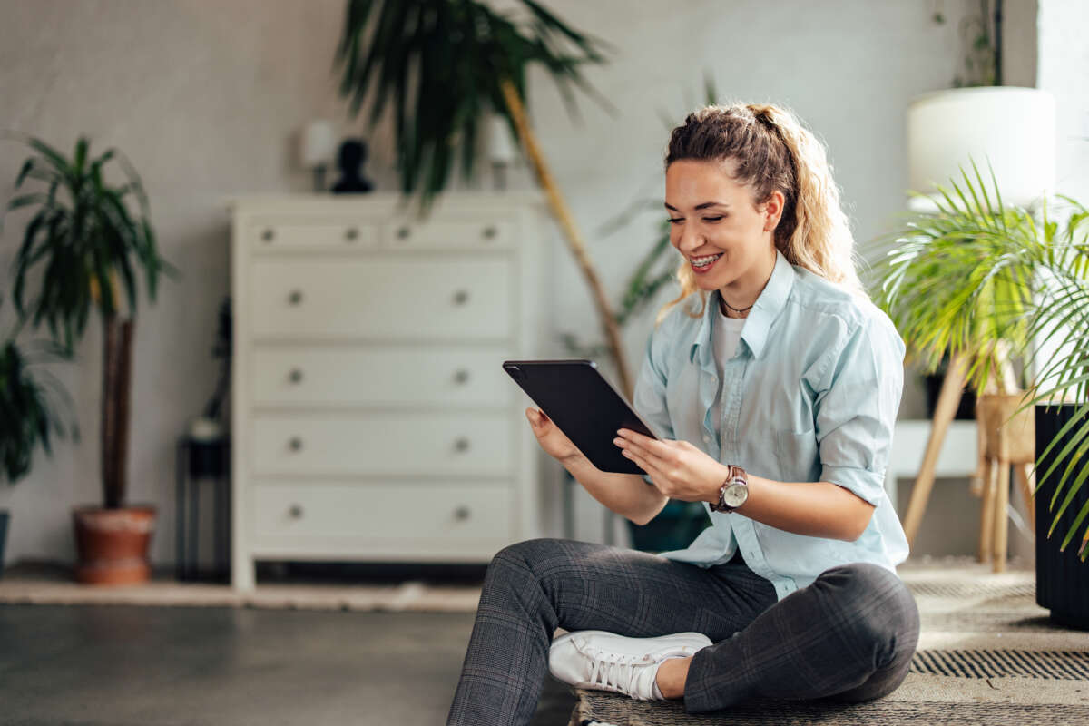 Happy blonde girl using a digital tablet working 2025 09 09 19 44 18 utc
